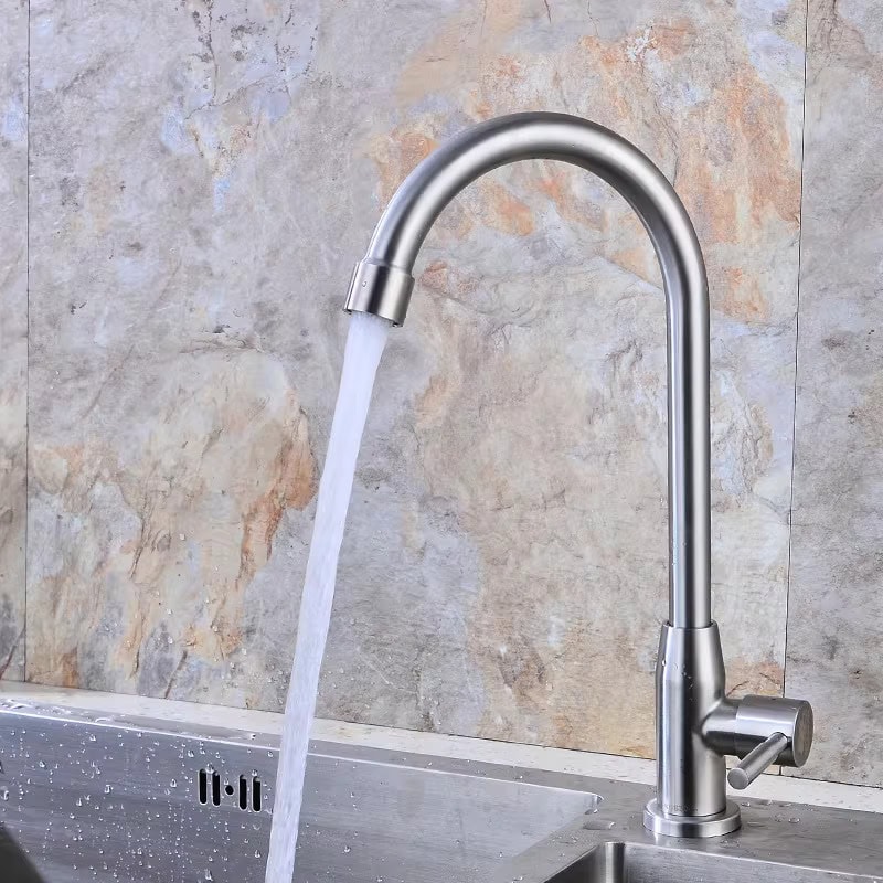 Stainless steel kitchen faucet with flowing water, ideal for modern kitchens.
