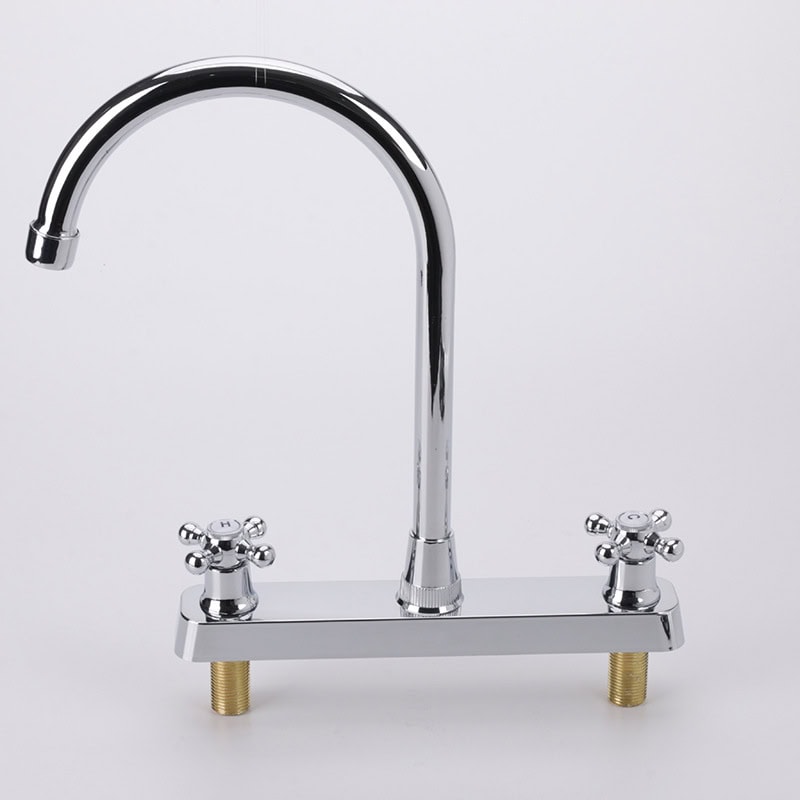 Chrome kitchen faucet with dual handles and high arc spout for modern kitchen design.