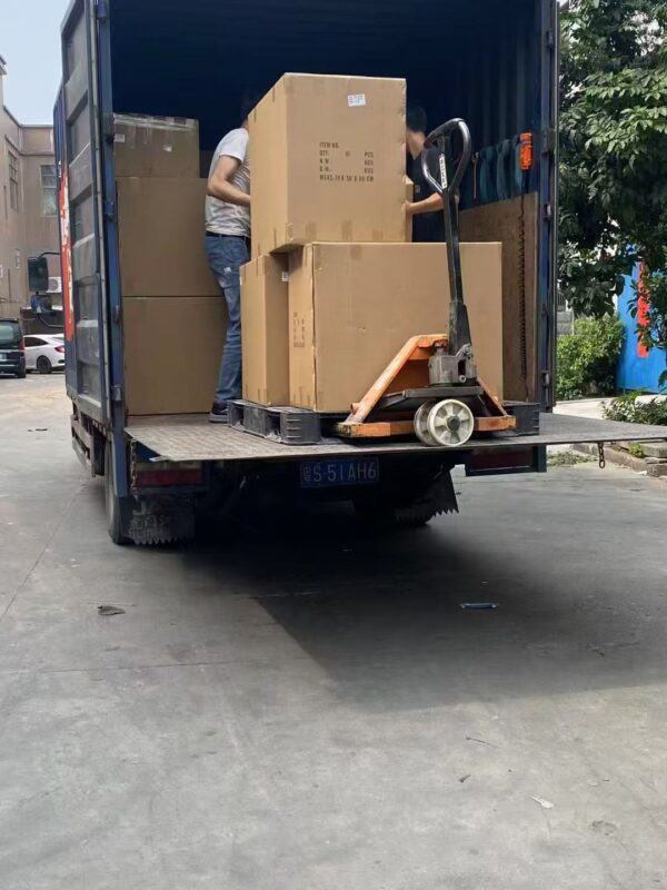 Moving boxes loaded onto a truck for delivery or relocation.