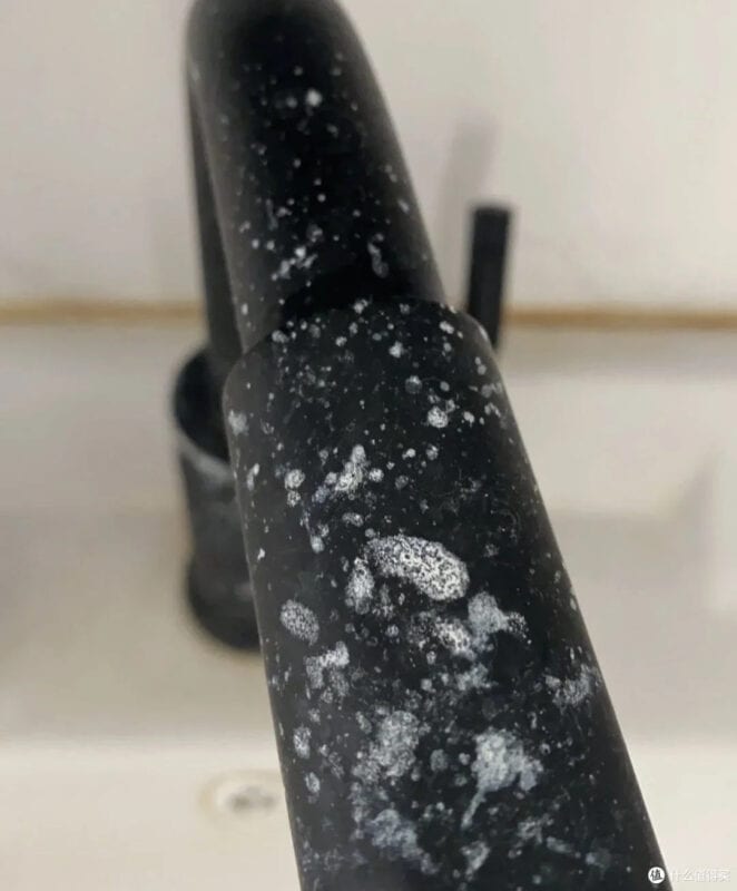 White mineral deposits on the faucet
