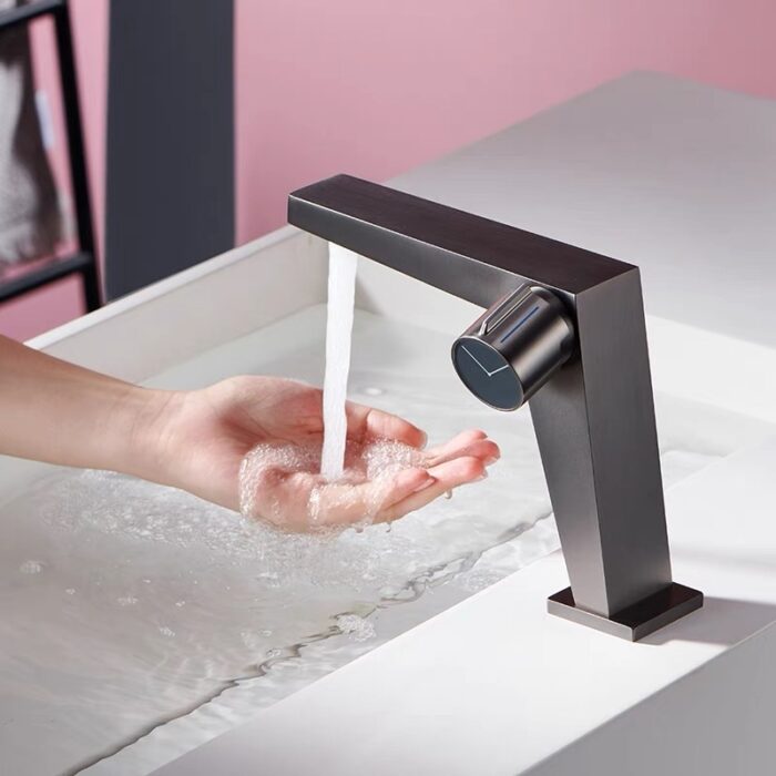 Sleek modern kitchen sink faucet with touchless sensor for hands-free water flow.
