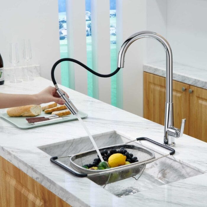 High-efficiency kitchen faucet with pull-down sprayer by A-Torneira, sleek stainless steel design.