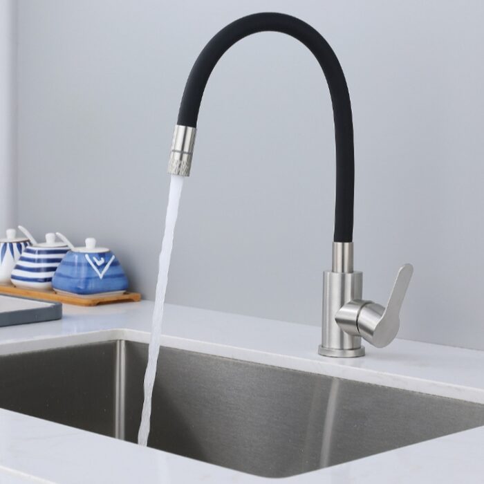 Sleek modern black and stainless steel kitchen faucet with water flow, on a clean white countertop.