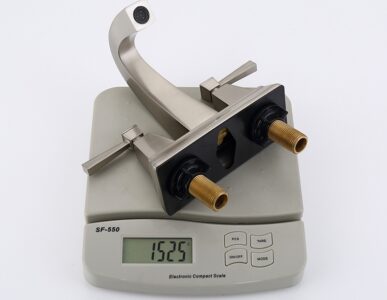 High-quality kitchen faucet with brass fittings and modern design on digital scale, ideal for home improvement.