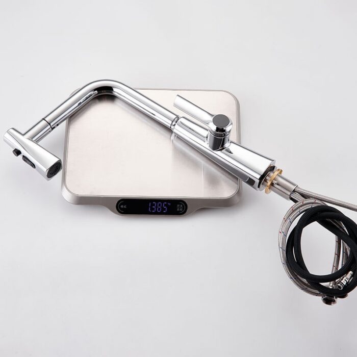 Shiny modern kitchen faucet with flexible hose on digital kitchen scale.
