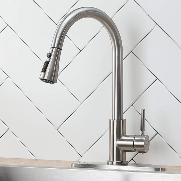 Stainless steel kitchen faucet with modern design and pull-down sprayer for home or commercial use.