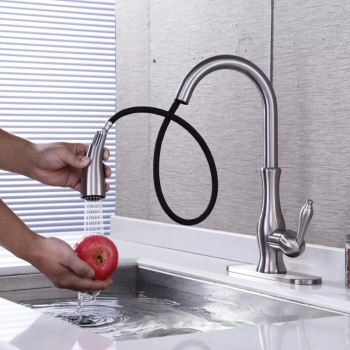 Elegant stainless steel kitchen faucet with flexible pull-down spray for efficient food prep and cleaning.