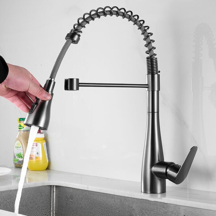 High-quality modern kitchen faucet with pull-down sprayer, stainless steel finish, and ergonomic handle for easy use.