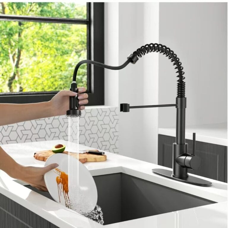 High-arc black kitchen faucet with pull-down sprayer for modern kitchen sink.