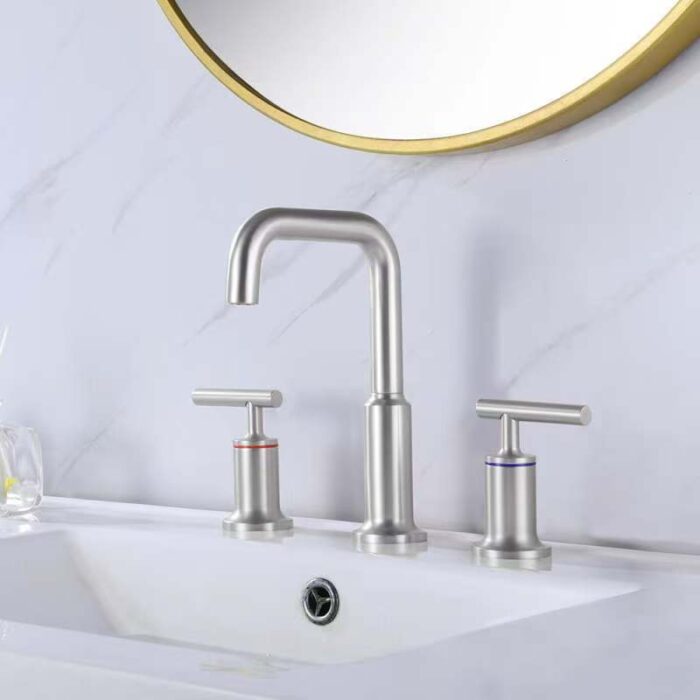 Stainless steel kitchen sink faucet with modern design, dual handles, and high-arc spout for stylish functionality.