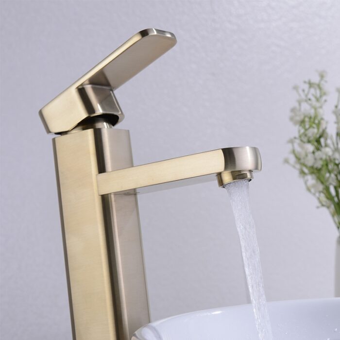 Sleek modern brass kitchen faucet with waterfall flow, ideal for contemporary bathroom or kitchen decor.