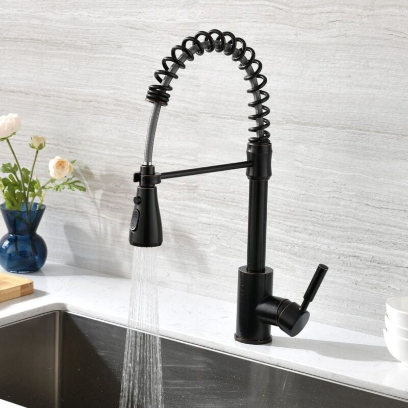 Black kitchen faucet with flexible spring spout and pull-down spray head for modern kitchen sink.