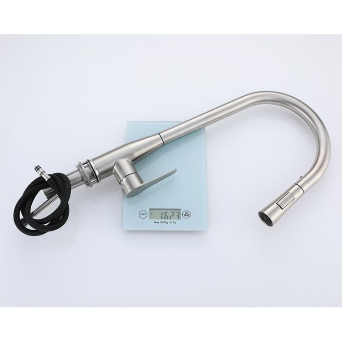 Brushed stainless steel kitchen sink faucet with pull-out sprayer on a digital scale.