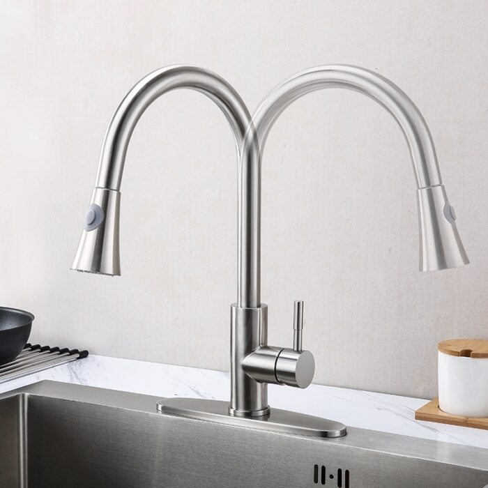 Dual stainless steel kitchen faucet with pull-down sprayers for modern kitchens.