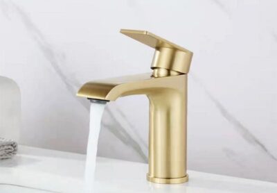 Brushed gold sink faucet, modern bathroom faucet with water flow for stylish kitchen or vanity upgrade.