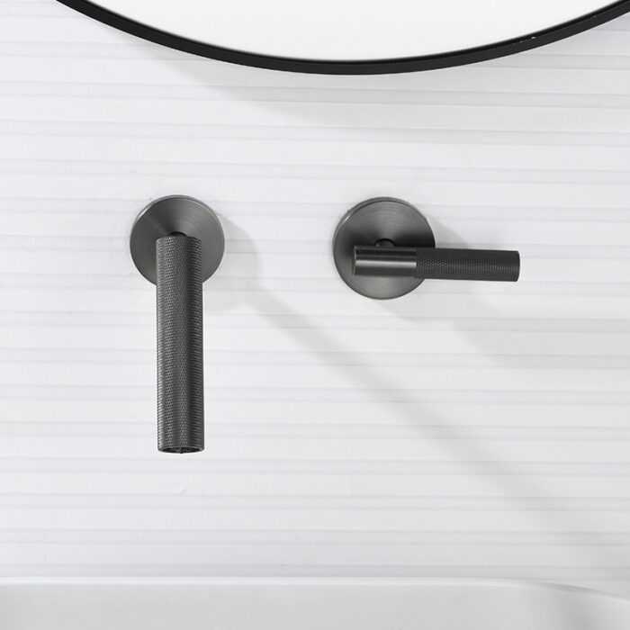 Sleek black matte faucet handles for modern bathroom or kitchen decor.