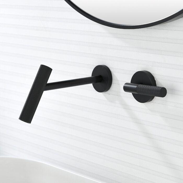 Modern black wall-mounted bathroom accessories, minimalist towel holder and hook, sleek white textured wall background.