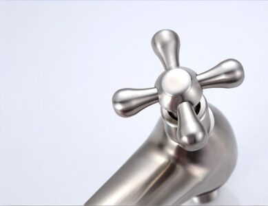 Stainless steel faucet tap handle for kitchen or bathroom decor.