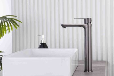 Sleek modern bathroom faucet in matte black finish with minimalist design and clean lines.
