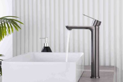 Sleek modern kitchen faucet with water flow feature for stylish kitchen sink setups.