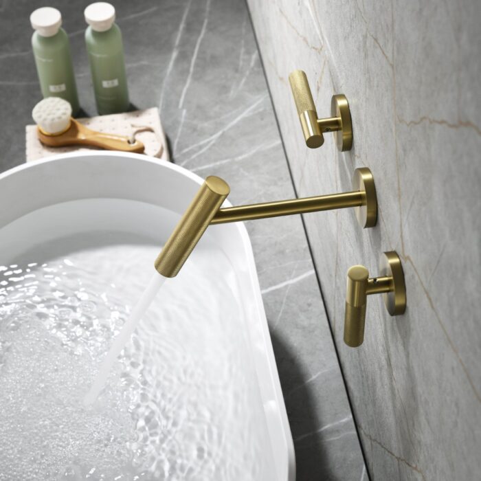 Brass bathroom faucet with modern design, flowing water into a bathtub, stylish and functional fixture.