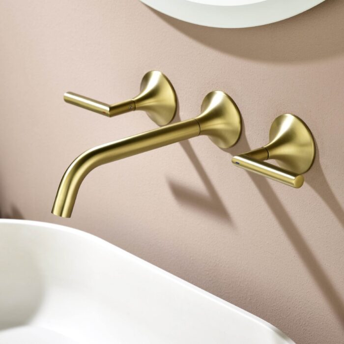 Brushed gold wall-mounted faucet for bathroom sink, modern design, high-quality fixtures, stylish home decor.