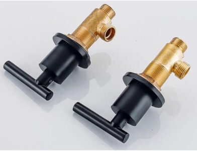 Brass and black faucet valves for plumbing systems, durable high-quality water control components.