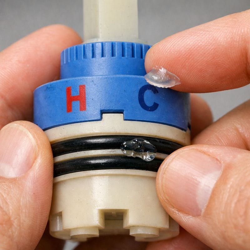Checking H and C markings and applying silicone grease to cartridge O-rings