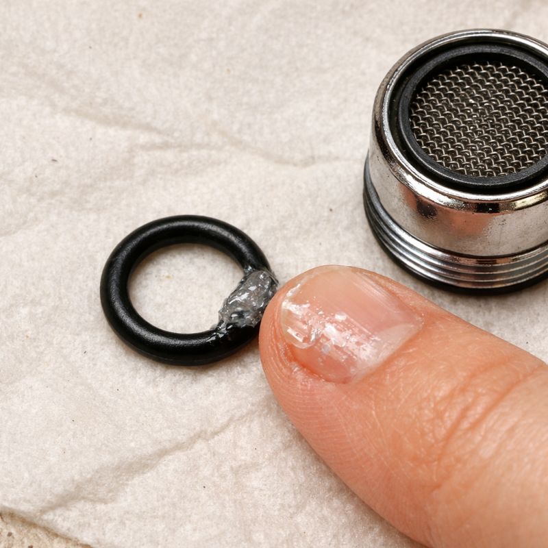 Applying a tiny amount of food-grade silicone grease to an O-ring before reassembly